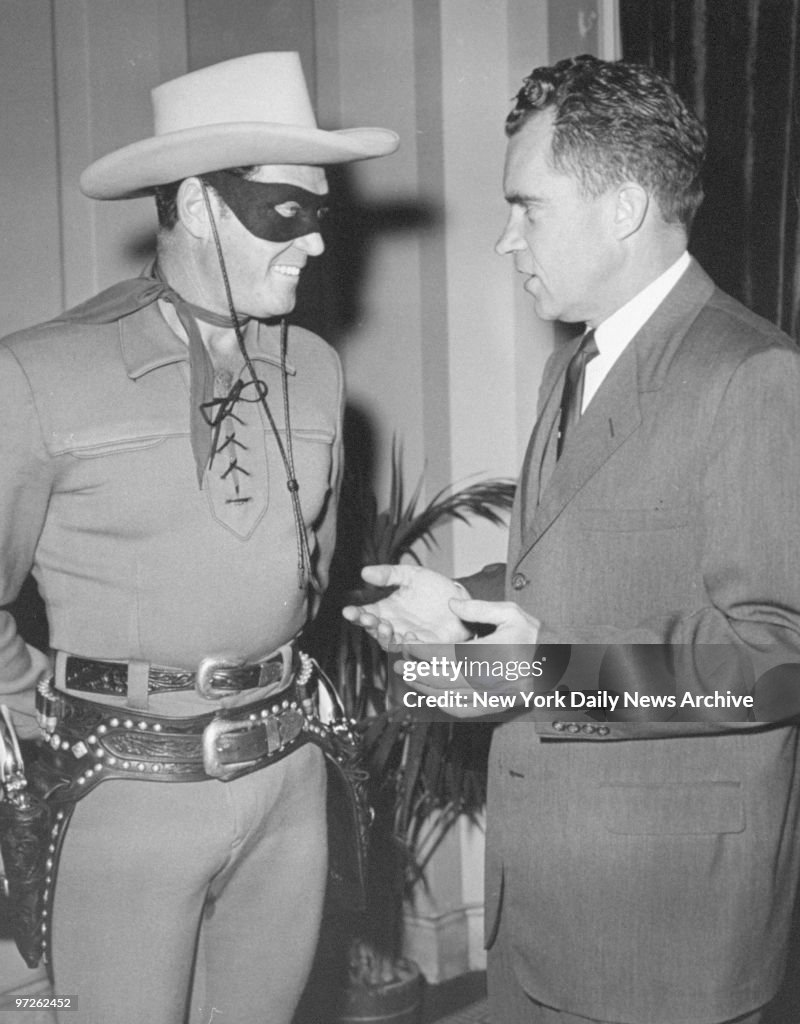 Clayton Moore, in costume as the Lone Ranger, with President