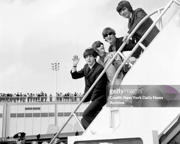Fans line the rooftop at Kennedy International Airport for a last glimpse of the Beatles -- Paul McCartney, Ringo Starr, John Lennon, and George...