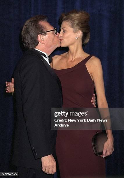 Larry King and fiance Shawn Southwick share a kiss at a New York Friars Club dinner at the Waldorf-Astoria.