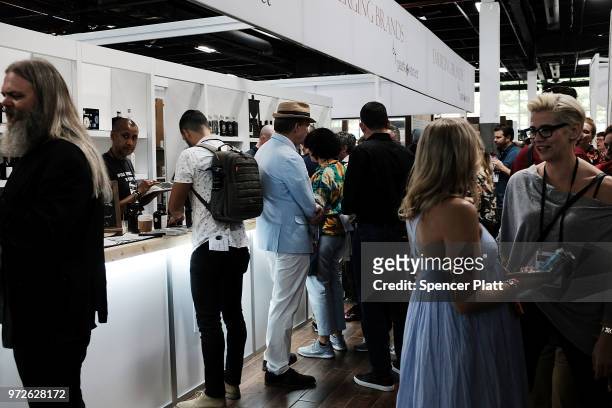 People attend Bar Convent Brooklyn, an international bar and beverage trade show at the Brooklyn Expo Center on June 12, 2018 in the Brooklyn borough...