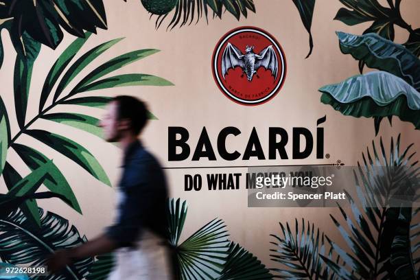 Wall displays an ad for Bacardi rum at Bar Convent Brooklyn, an international bar and beverage trade show at the Brooklyn Expo Center on June 12,...