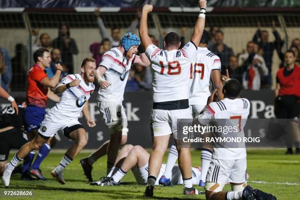 France's players celebrate at the end of the U20 World Rugby union Championship semi-final match between France and New-Zealand at the Aime Giral...