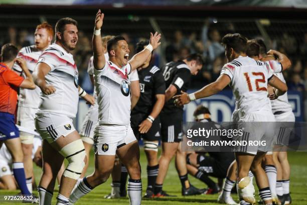 France's players celebrate at the end of the U20 World Rugby union Championship semi-final match between France and New-Zealand at the Aime Giral...
