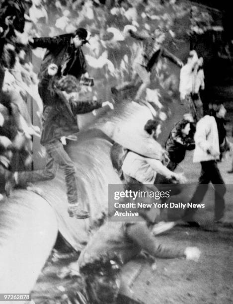 Fans riot at Shea Stadium during The Who's farewell concert.