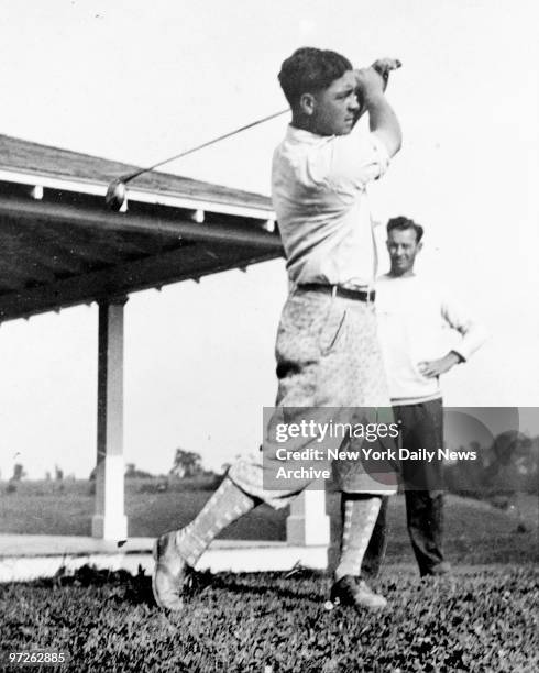 LaVerne Moore alias John Montague, mysterious golfer picture taken in 1927 shown demonstrating swing with iron club, faces extradition to Essex...