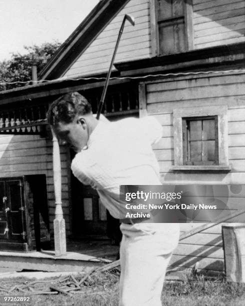 LaVerne Moore alias John Montague, mysterious golfer picture taken in 1927 shown demonstrating swing with iron club, faces extradition to Essex...