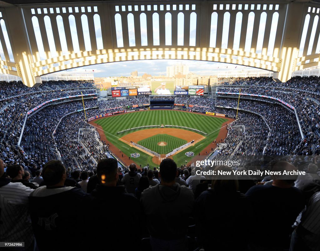 Fans stand for The National Anthem when the New York Yankees