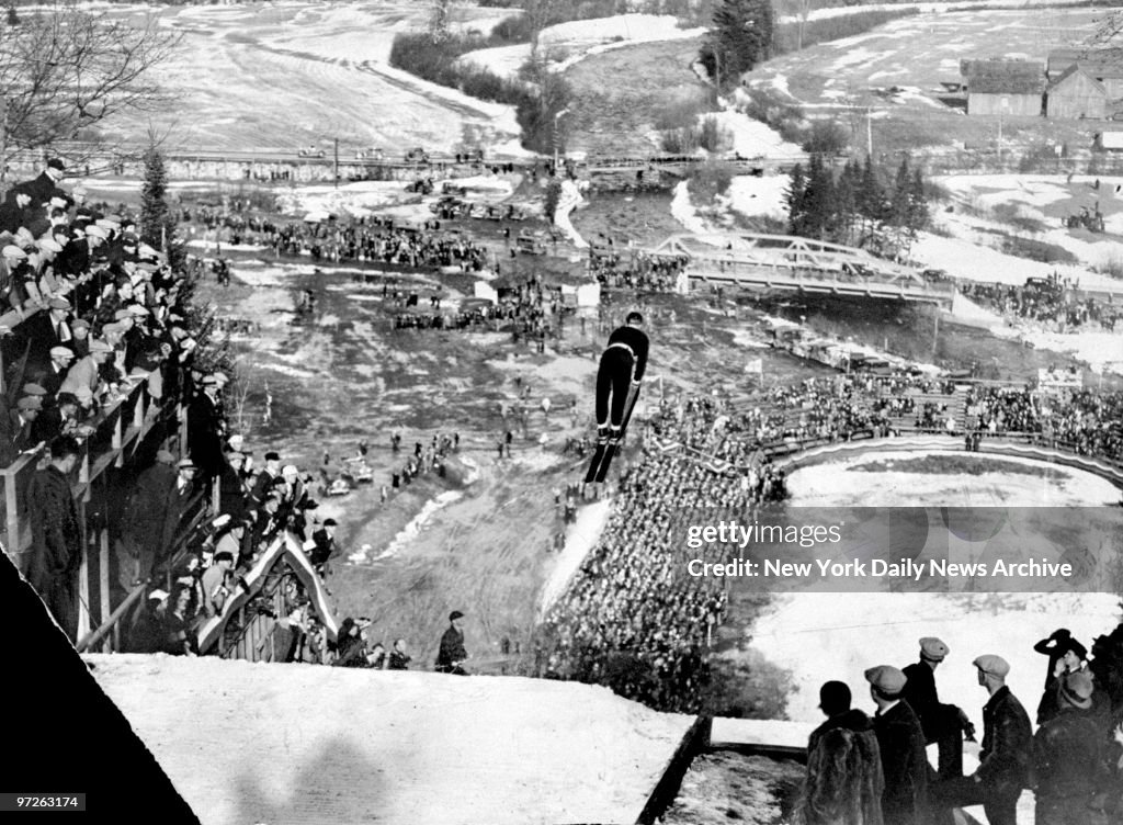 Birger Ruud, of Norway, in midair during his ski jump at the