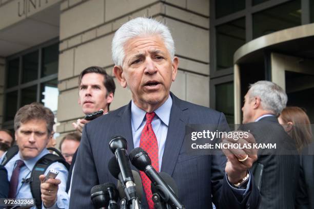 And Time Warner attorney Daniel Petrocelli speaks to the press after a court ruled that the 85 billion USD merger between AT&T and Time Warner could...