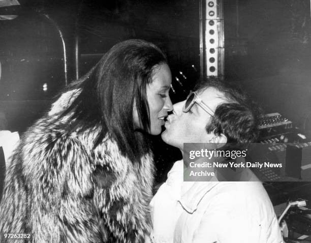 Model Beverly Johnson gives Steve Rubel a farewell kiss at Studio 54.