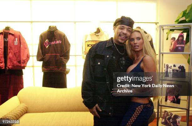 Ice-T and his fiance, Coco, show off some denim outfits from the rapper's new clothing line, Icewear, on W. 34th St. The collection features urban...