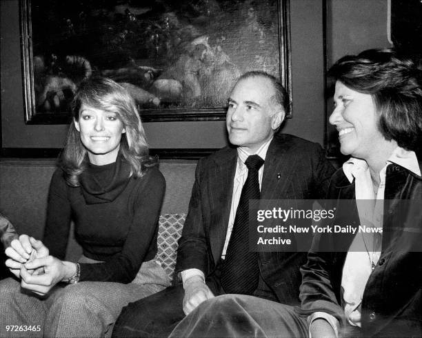 Farrah Fawcett and Liz Smith celebrate Farrah's birthday with unidentified man in the middle.