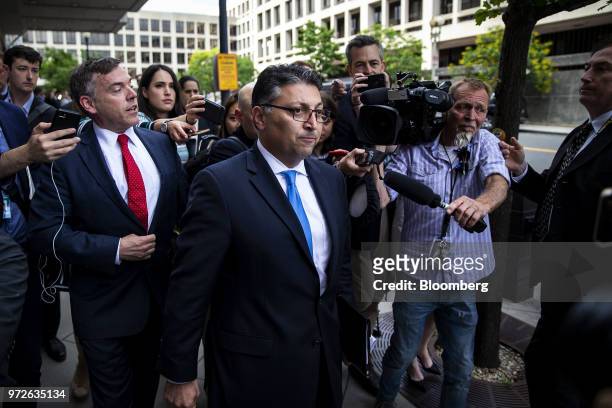 Makan Delrahim, U.S. Assistant attorney general for the antitrust division, center, departs from federal court in Washington, D.C., U.S., on Tuesday,...