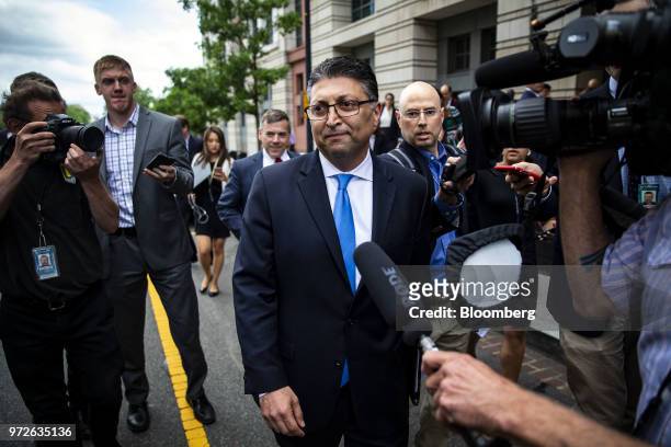 Makan Delrahim, U.S. Assistant attorney general for the antitrust division, center, departs from federal court in Washington, D.C., U.S., on Tuesday,...