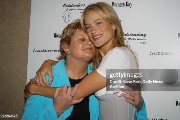 Model Carolyn Murphy gets a hug from her mom, Laura, at the 25th Annual Outstanding Mother Awards at the Marriott Marquis. Murphy was given an award...