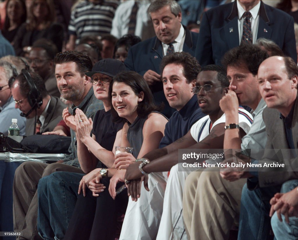 Row of celebrities cheering for the New York Knicks against