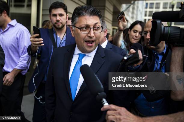 Makan Delrahim, U.S. Assistant attorney general for the antitrust division, center, speaks to members of the media outside of federal court in...