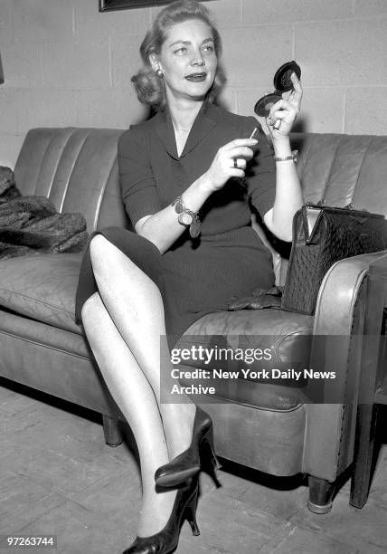 Lauren Bacall at Idlewild Airport freshens up before boarding airplane for Los Angeles after spending one month in New York working on her latest...