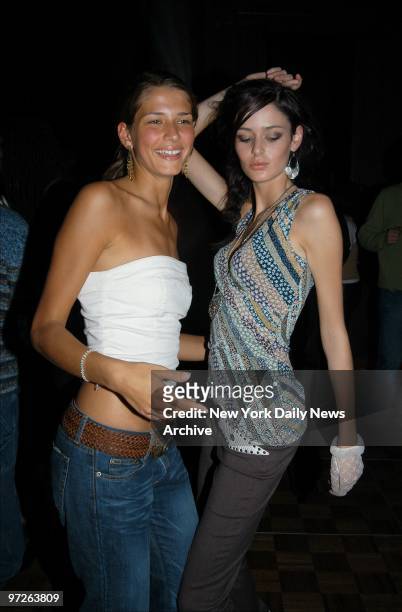 Model Dari Maximova of Germany , dances with Nicole Trunfio of Australia, during Island Def Jam's holiday party at Capitale restaurant on Grand St....
