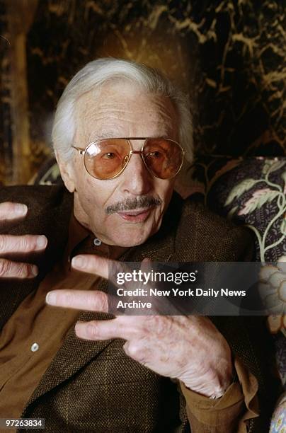 Fashion designer Oleg Cassini at his E. 63rd St. Townhouse. He takes issue with comments in the catalogue for an upcoming exhibit of the Metropolitan...