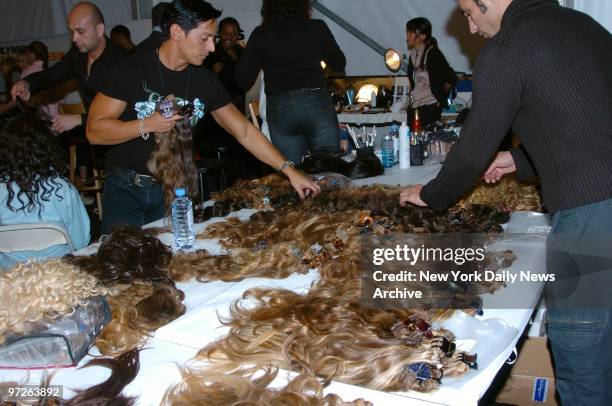 Clip-on hair extensions are laid out on a table for models before a showing of the Jennifer Lopez fall 2005 collection in the Tent at Bryant Park...