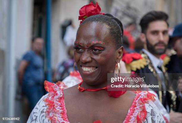 Dancer of Marcha de Bica is seen dressed in costume in the old quarter of Bica before leaving to parade in Avenida da Liberdade on June 12, 2018 in...