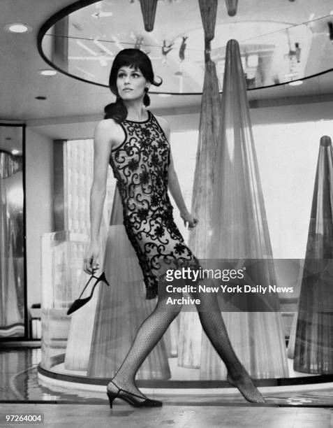 Fashion model Lauren Hutton modeling a Lucrezia Borgia style dress created by designer Chuck Howard during the dedication of the new Allied Chemical...