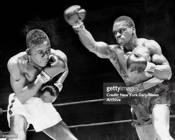 Rubin "Hurricane" Carter vs. George Benton during action in the tenth round. Hurricane won the split decision at Madison Square Garden.,