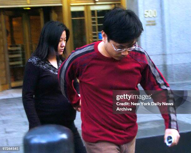 Rubin Chen, and his wife Jennifer Wang, as they rush out of Federal Court after being charged with insider trading.
