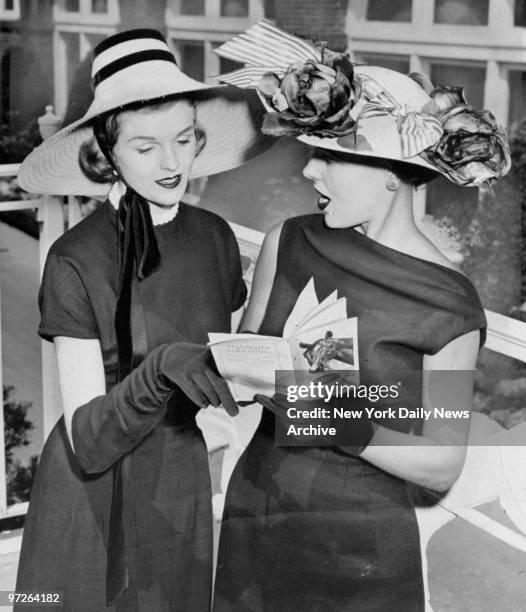 Fashions of the '50s: Models Joan Hass and Jean Thompson wear straw hats as the millinery designers paraded their summer creations for Belmont Park's...