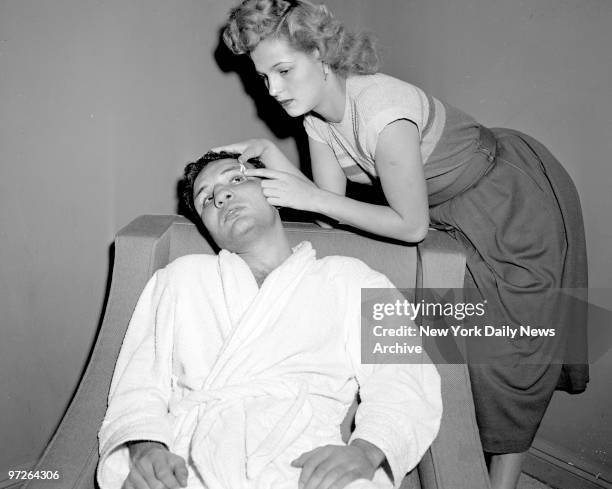 In his Bronx home, Jake LaMotta gets some loving care from his wife, Vicki. Favored at better than 3-1, Jake lost a unanimous decision when he found...
