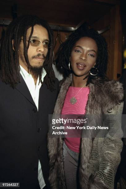 Lauryn Hill with her boyfriend Rohan Marley attending Holiday Benefit party for Refugee Project at Emporium Armani.