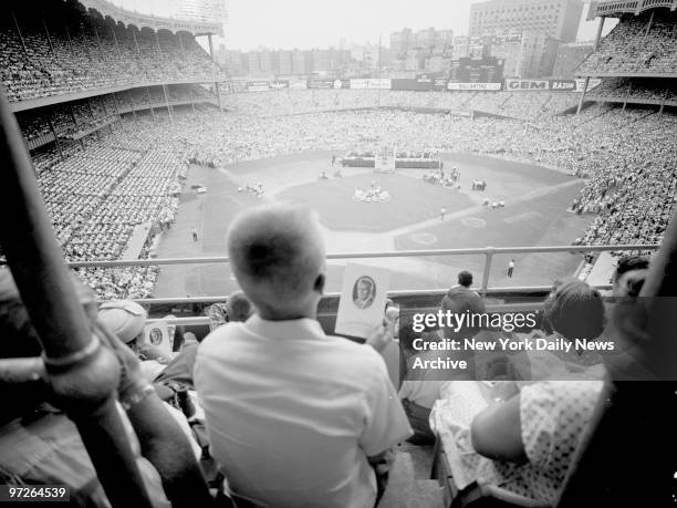 In spite of the 90-degree-plus heat 100,000 persons packed Yankee Stadium to hear the Rev. Dr. Billy Graham warn that America "is facing its gravest...