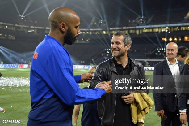 Thierry Henry of France 98 and Guillaume Canet of react after the friendly match between France 98 and FIFA 98 at U Arena on June 12, 2018 in...