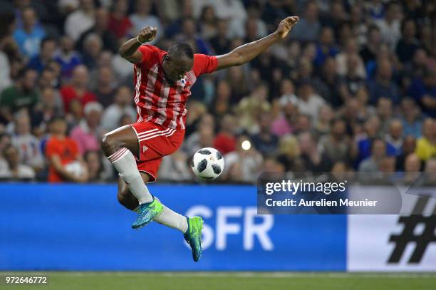 Usain Bolt of FIFA 98 controls the ball during the friendly match between France 98 and FIFA 98 at U Arena on June 12, 2018 in Nanterre, France.