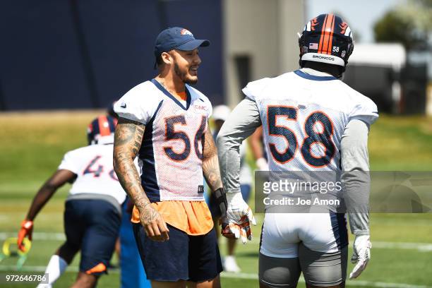 Denver Broncos linebacker Shane Ray with linebacker Von Miller during drills on the 1st day of mandatory minicamp for all Broncos players June 12,...