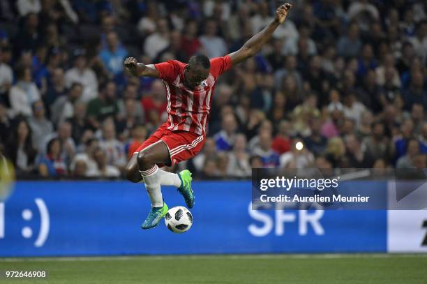 Usain Bolt of FIFA 98 controls the ball during the friendly match between France 98 and FIFA 98 at U Arena on June 12, 2018 in Nanterre, France.