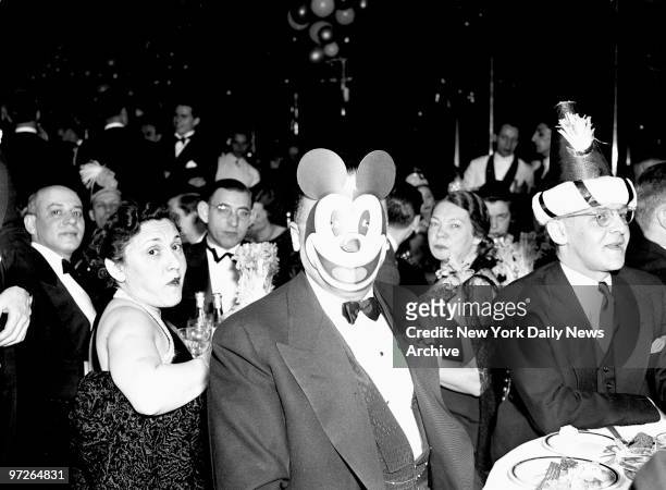 Director J. Edgar Hoover wearing Mickey Mouse mask at New Year's Eve party.