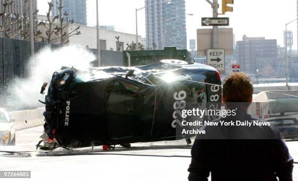 In this stunt scene a ambulance runs into the police car that is carrying the ransom money to the hijackers during filming at 42 St and 1st Ave for...