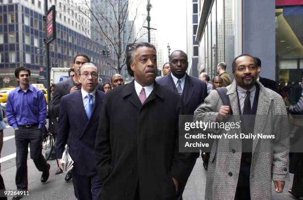 Lawyer Sanford Rubenstein , the Rev. Al Sharpton , and Jonas Louima , brother of police torture victim Abner Louima, arrive at Gov. Pataki's...