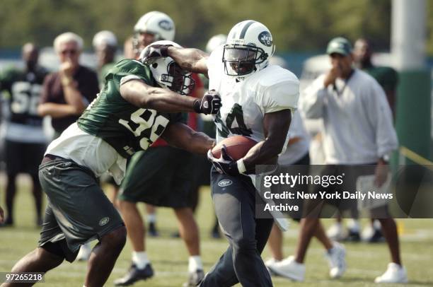 Running back LaMont Jordan gets by a tackler at the New York Jets' training facility in Hempstead, L.I.