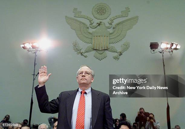 Independent counsel Kenneth Starr swears in before testifying at the House Judiciary Committee hearings on whether to impeach President Clinton.