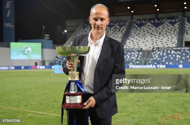 Accademy Director of FC Internazionale Juvenile Roberto Samaden of FC Internazionale shows the trophy after winning the Serie A Primavera Playoff...