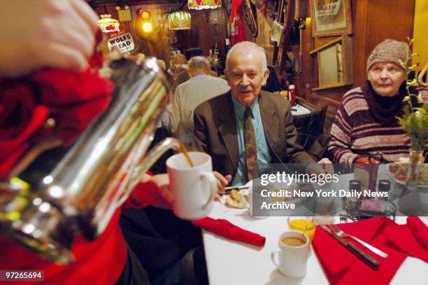 Coffee is poured for diners as Riese Restaurants group hosts their annual Holiday Senior Breakfast for 250 Citymeals-on-Wheels homebound seniors at...