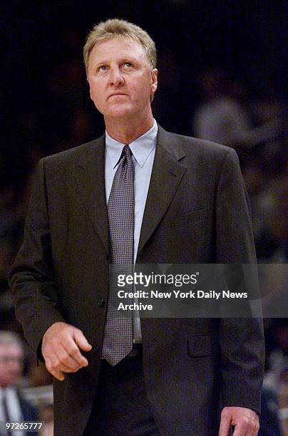 Indiana Pacers' coach Larry Bird looks up at the scoreboard in the waning moments of Game 6 of the Eastern Conference Finals against the New York...