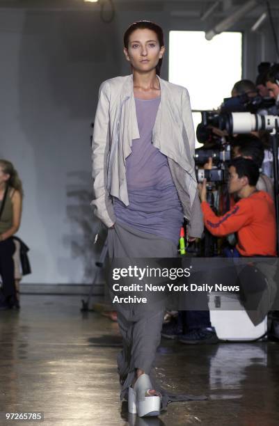 Model saunters down runway in an outfit from the new Rick Owens collection during show at W. 45th St. As part of Spring Fashion Week 2003.