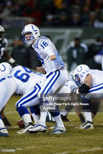 Indianapolis Colts' quarterback Peyton Manning audibles to change play during the first half of AFC wild-card playoff game against the New York Jets...