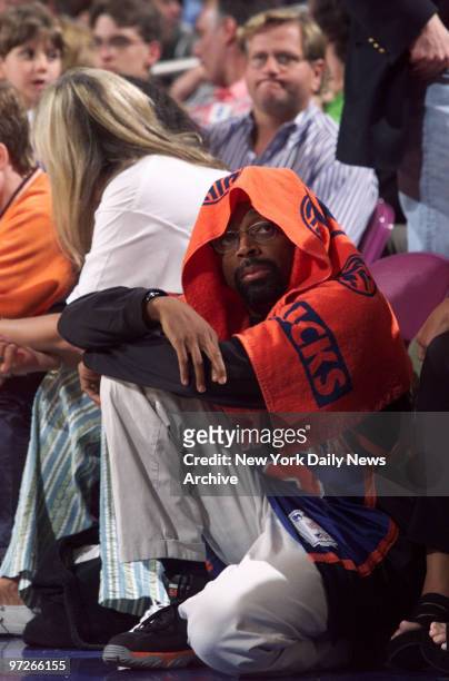 Film director Spike Lee watches from the sideline as the New York Knicks take on the Indiana Pacers in the Eastern Conference finals at Madison...
