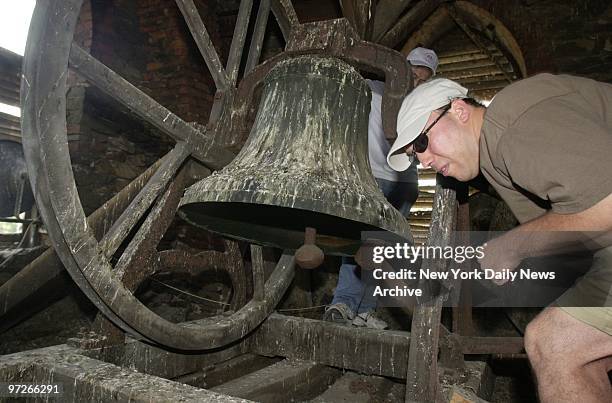 Lenny Bartolone bends to the task as he rings the nearly 300-year-old bell 13 times - for the original 13 states - in celebration of Independence Day...