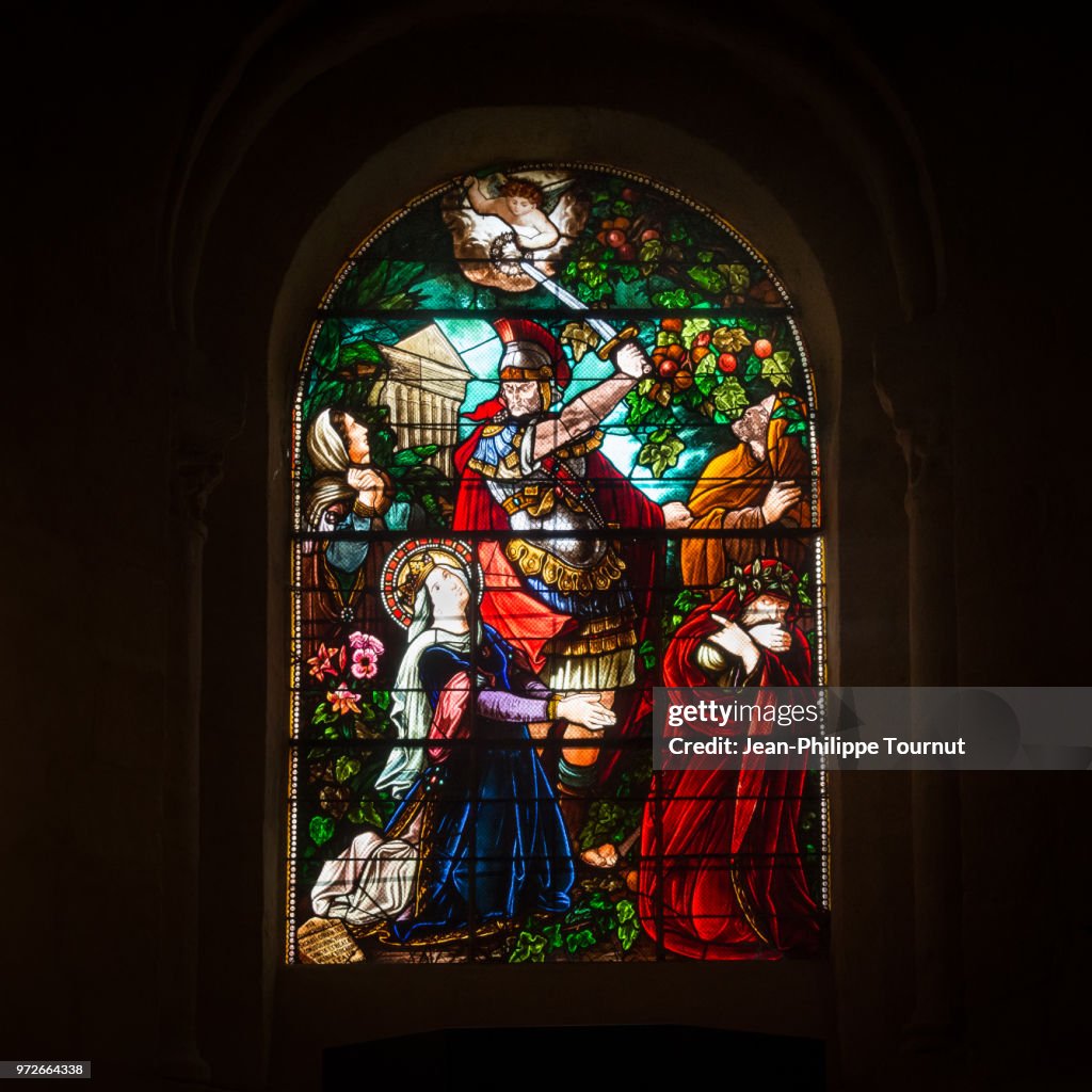 Stained Glass Window depicting the martyrdom of Saint Valerie who was beheaded by her husband, Monastery of St. Valerie in Chambon sur Voueize, Abbatiale Sainte Valérie, Creuse, France